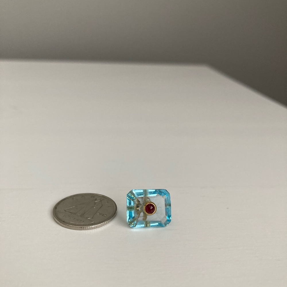 Aquamarine charm with red garnet inset